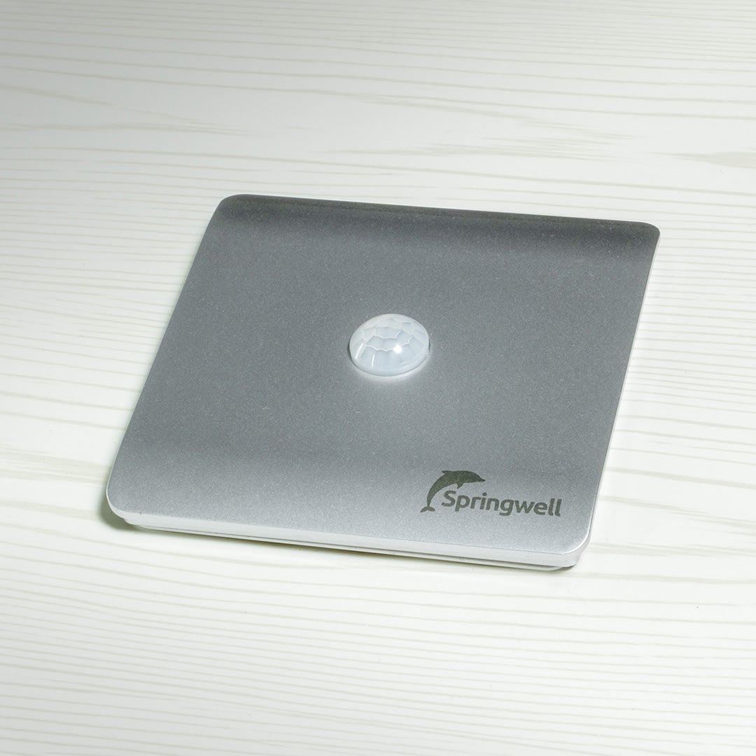 Silver motion sensor with 'Springwell' branding on a white background